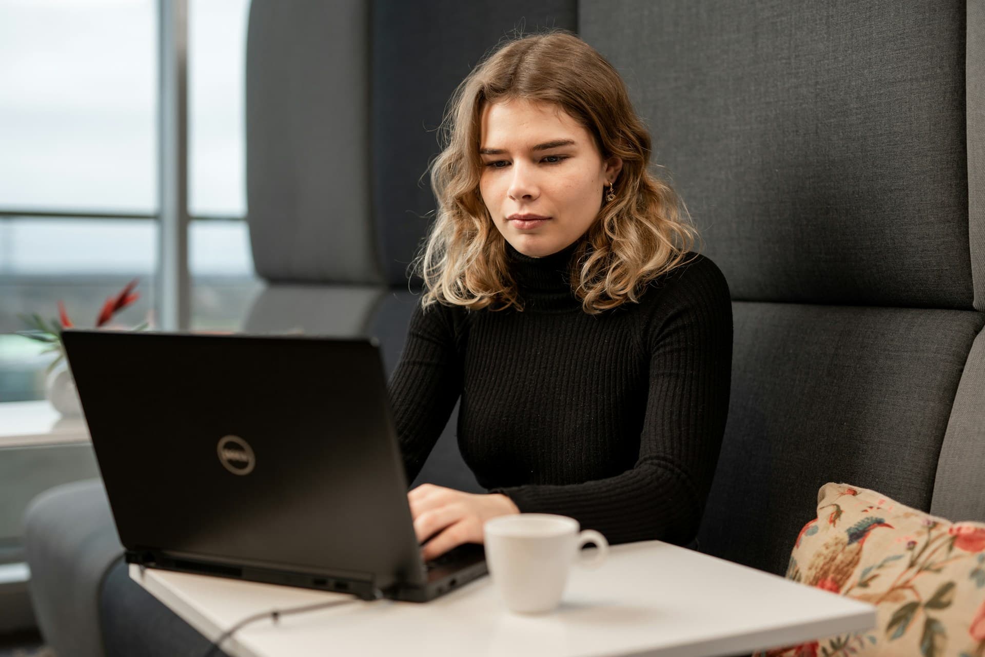 Image of a women working on a laptop